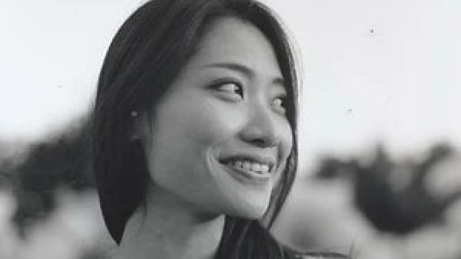Smiling woman looking away from camera